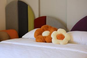 Postel nebo postele na pokoji v ubytování 鴝花甜點民宿 QuHua Sweety B&B