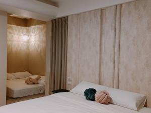 Postel nebo postele na pokoji v ubytování 鴝花甜點民宿 QuHua Sweety B&B
