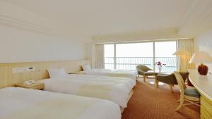 Posteľ alebo postele v izbe v ubytovaní Irago Resort & Convention Hotel