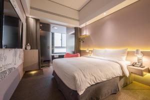 Postel nebo postele na pokoji v ubytování Ramble Hotel