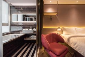 Postel nebo postele na pokoji v ubytování Ramble Hotel
