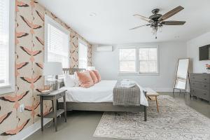 a bedroom with a bed and a ceiling fan at Afton Clubhouse in Afton +31 photos