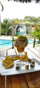 a plate with a drink and a bowl of food at Hotel Bambú in Canoa