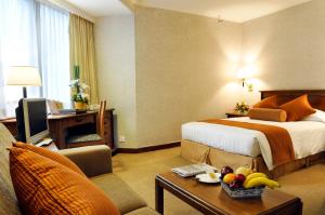 A bed or beds in a room at The Kimberley Hotel