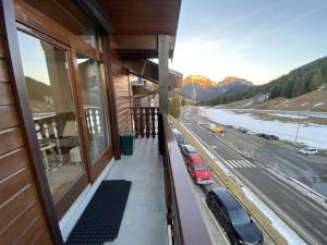 a balcony of a house with cars parked on the street at Studio Le Biot, 1 pièce, 5 personnes - FR-1-573-55 in Le Biot