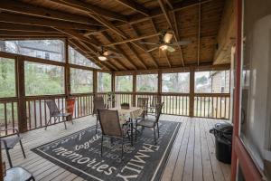 a screened in porch with a table and chairs at Mountain View GetAway in Stone Mountain
