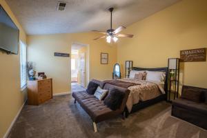 a bedroom with a bed and a couch at Mountain View GetAway in Stone Mountain