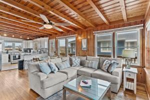 a living room with a couch and a table at Dock Holiday in Oak Island