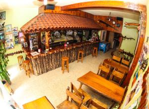 an overhead view of a restaurant with a bar at El Molino in Melide