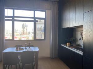 Kuchyň nebo kuchyňský kout v ubytování base-PUSAN Serviced Apartment -Shanghai New International Expo Centre