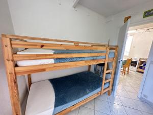 a couple of bunk beds in a room at Maison charmante à Collioure, à 200m de la plage, avec jardin et proche des commerces! - FR-1-309-368 in Collioure
