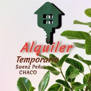 un panneau avec une maison verte sur une plante dans l'établissement CBH Alquiler Temporario, à Presidencia Roque Sáenz Peña