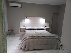 Giường trong phòng chung tại CBH Alquiler Temporario