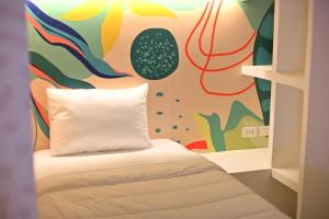 Giường trong phòng chung tại Hotel Nomadic Design
