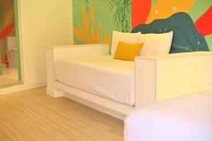 Giường trong phòng chung tại Hotel Nomadic Design