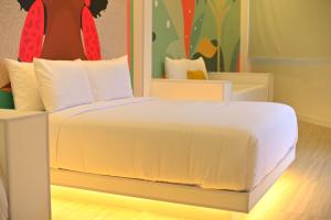 Giường trong phòng chung tại Hotel Nomadic Design