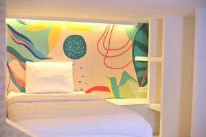 Giường trong phòng chung tại Hotel Nomadic Design