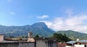 a view of a mountain from a city with houses at Suite Aries in Tlatlauquitepec