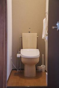 a bathroom with a white toilet in a room at Kokoro no sato・Hitomi in Kyoto +29 photos