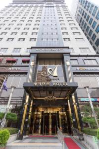 a building with a star hotel sign in front of it at Yeoksam Artnouveau City Hotel and Residence in Seoul