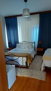 Postel nebo postele na pokoji v ubytování Traditional Guesthouse Vrigiis