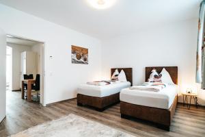 A bed or beds in a room at Gemütliche Wohnung im Zentrum Top 2