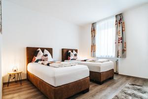 A bed or beds in a room at Gemütliche Wohnung im Zentrum Top 2