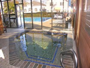 a swimming pool on the side of a house at Beau Rivage Motel in Old Orchard Beach +76 photos