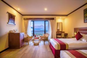 Giường trong phòng chung tại Rupakot Resort