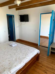 Postel nebo postele na pokoji v ubytování CORBU ACCOMMODATION + 3 fotografie