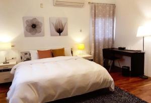 Llit o llits en una habitació de 田園城堡包棟民宿