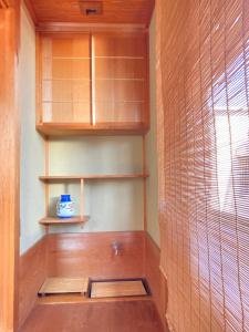 a room with wooden shelves and a window at Guesthouse Namaste in Kanazawa +24 photos