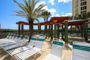 a group of chairs and a gazebo at Incredible Great Deals On This Hidden Gem Gulf Front Condo at The Pearl Sleeps 8 in Navarre