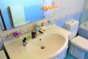 A bathroom at Villa Fotini with ocean view