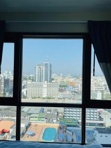 Nespecifikovaný výhled na destinaci Pattaya Central nebo výhled na město při pohledu z apartmánu