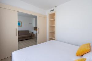 Ein Bett oder Betten in einem Zimmer der Unterkunft Atenea Park Suites & Apartments