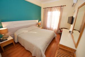 Llit o llits en una habitació de Hotel Dalia