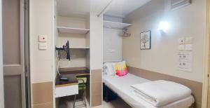 Postelja oz. postelje v sobi nastanitve Apple Hostel 蘋果賓館