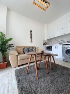 a living room with a table and a couch at Elegant Stay in Hurghada
