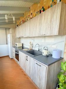 A kitchen or kitchenette at Kathiana cozy apartment