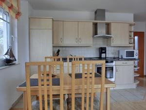Kuchyň nebo kuchyňský kout v ubytování Ferienwohnung H23