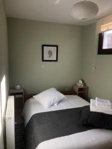 a bedroom with a bed and two night stands at DIAMOND Stone Wooden Guest House in Khandria +39 photos