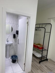 a bathroom with a sink and a mirror at Deeps Hostel Ankara 2 in Ankara