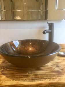 a wooden counter with a sink in a bathroom at HENWICK HOUSE Beautiful flat,Private parking, short walk to town in Ludlow