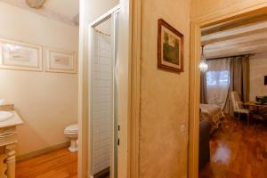 A bed or beds in a room at Gallery Guesthouse
