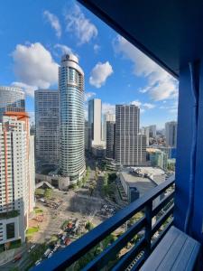 a view of a city skyline from a balcony at Great View 1 BR Condo in Makati near Trident Tower in Manila