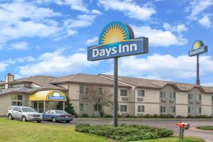 a days inn sign in front of a hotel at Days Inn by Wyndham West-Eau Claire in Eau Claire