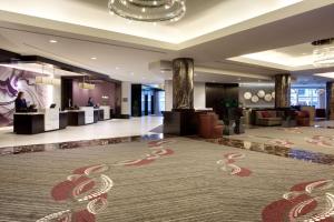 a lobby of a hotel with a large carpet at Hyatt Regency Boston in Boston