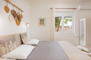 Posteľ alebo postele v izbe v ubytovaní Aloe Apartments