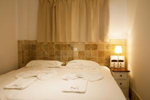 A bed or beds in a room at Villa Magna Még 3 kép